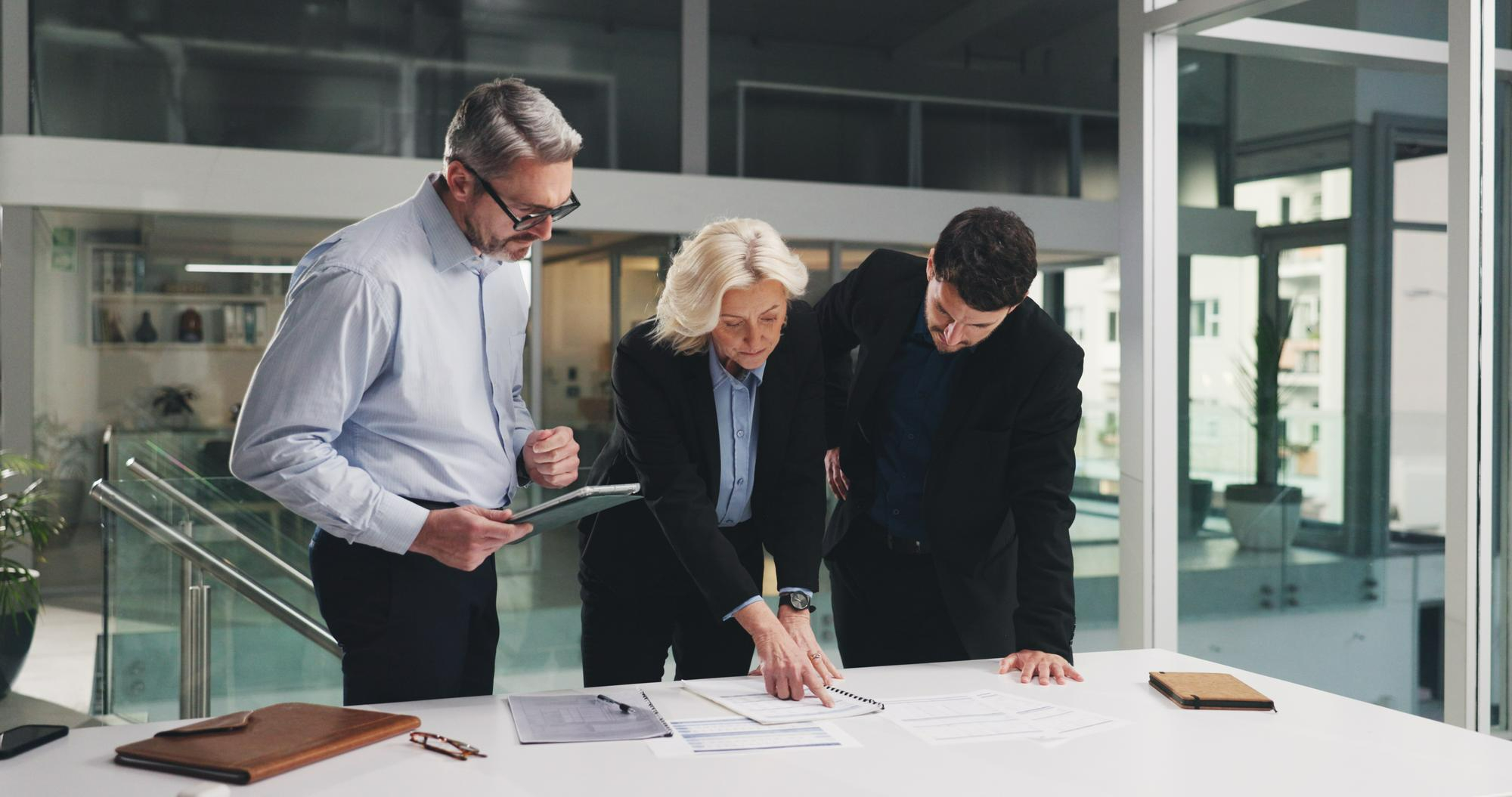 Colleagues reviewing documents together at a table